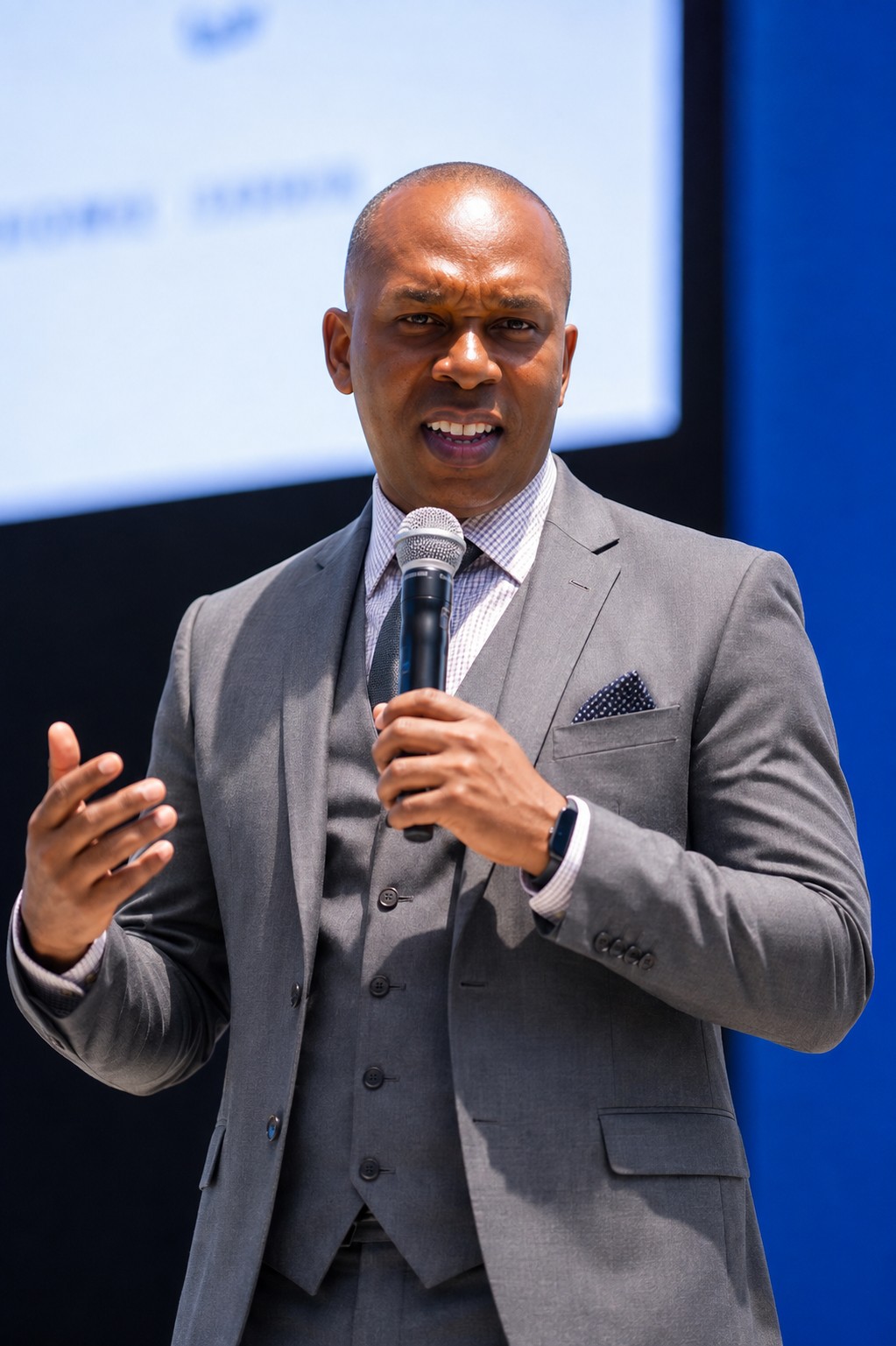 Dr. Sam Dozie speaking to an audience.